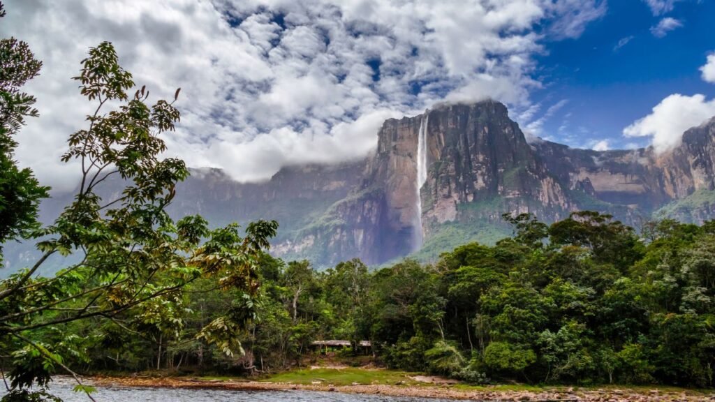 Angel Falls cascading down a towering tepui cliff in Canaima National Park, Venezuela, surrounded by dense rainforest